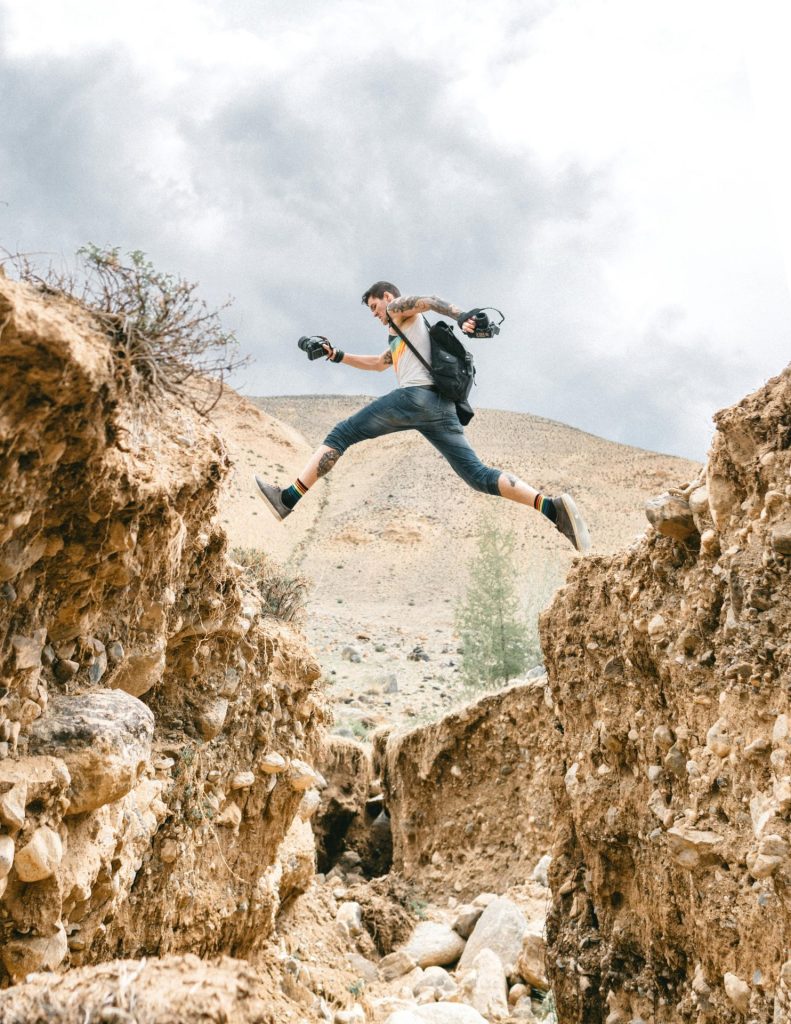 Man jumps over chasm